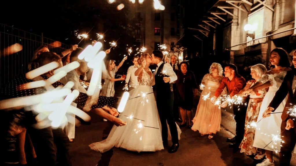 bride and groom exit with sparklers - wedding day timeline 