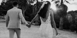 bride and groom holding hands