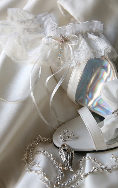 white wedding shoes and garter 