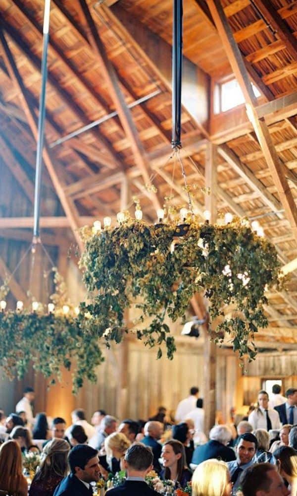 wagon wheel chandelier for rustic barn wedding 