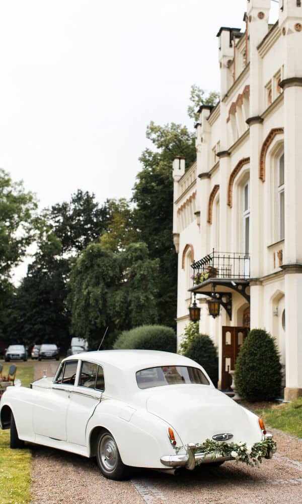 vintage white wedding car 