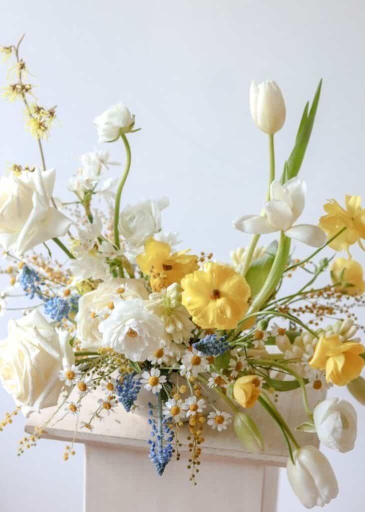 white and yellow wildflower wedding centerpieces spring 