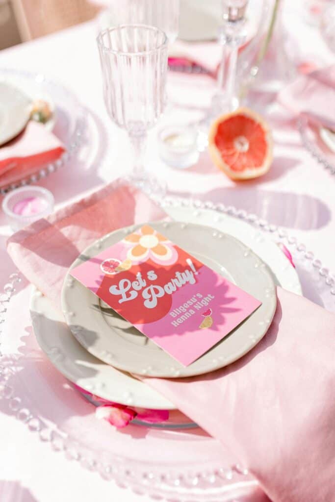 galentines party activities decor - pink napkins, pink menu. pink glassware