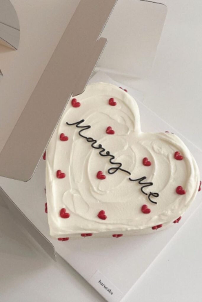 marry me cake in white love heart shaped cake