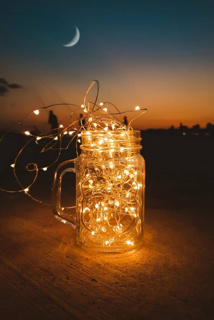 upcycled mason jars with fairy lights in it