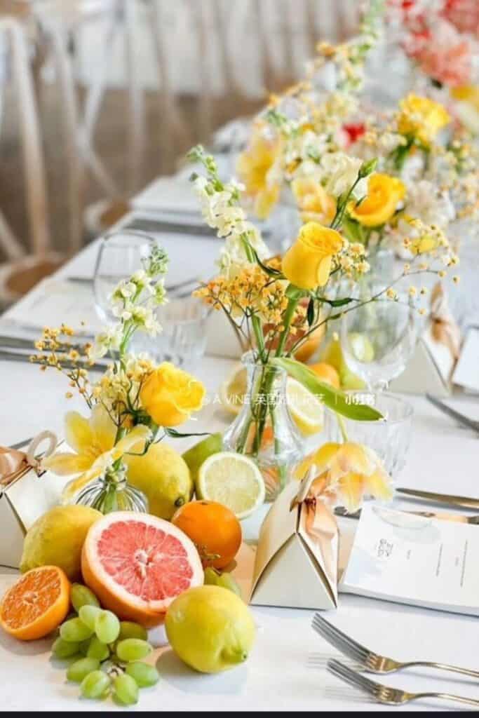 flowers in bud vases on wedding table
