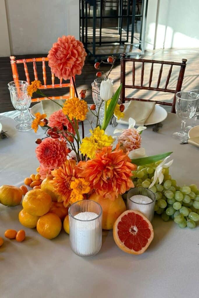 fruit and flowers centerpiece - orange flowers