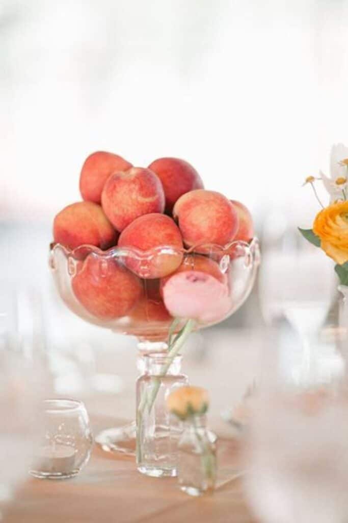 peaches in glass goblet as wedding table centerpiece