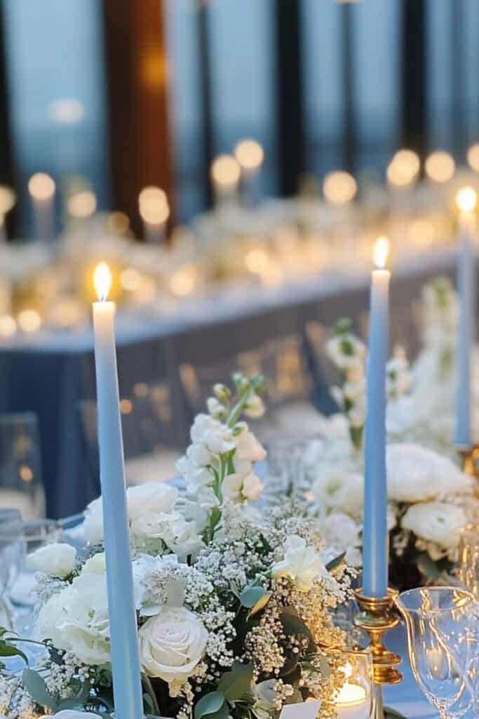 dusty blue taper candles on wedding table