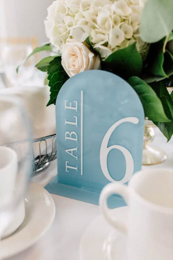 blue and white table numbers for wedding