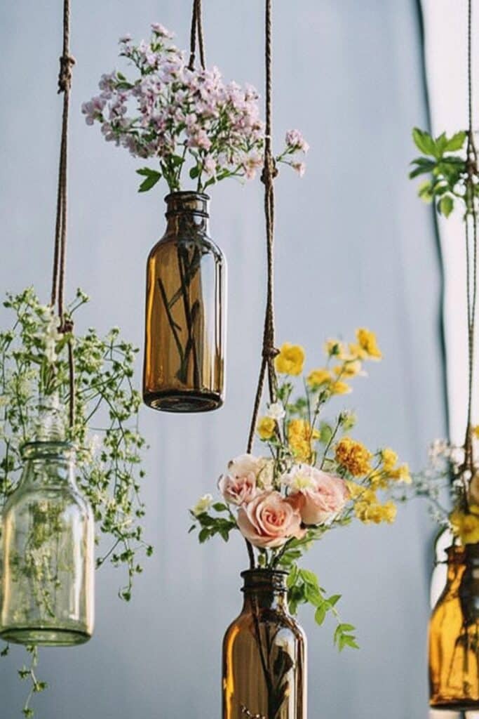 hanging bottles with flowers in