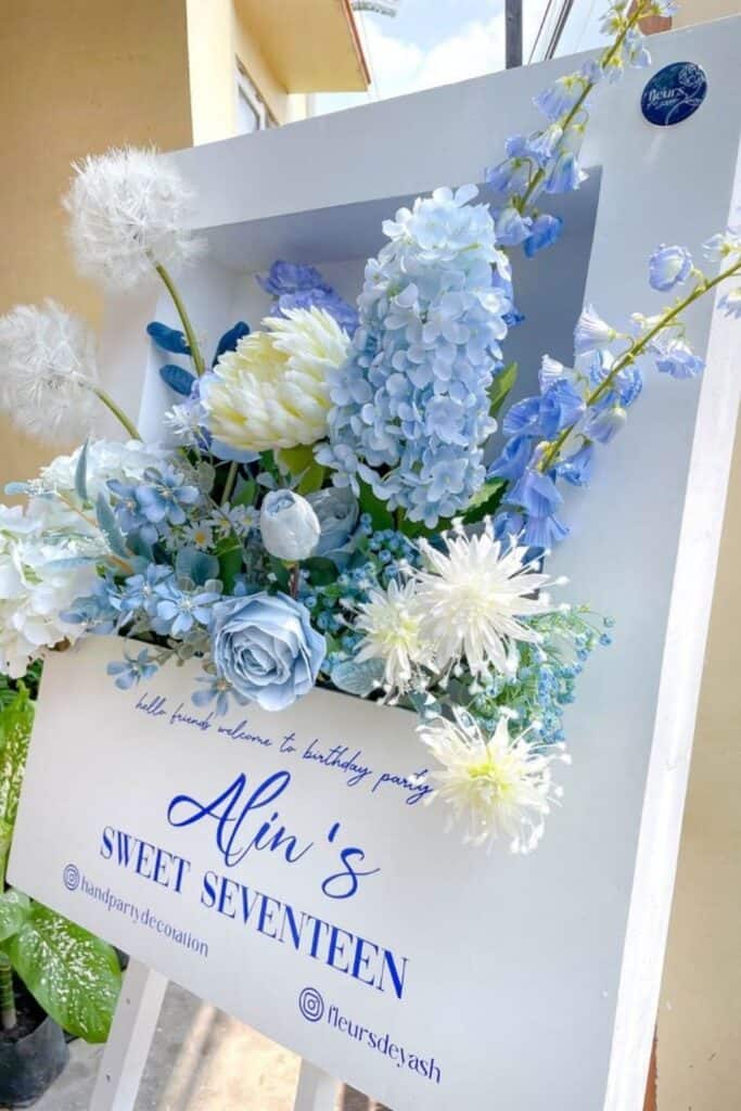 blue and white welcome sign for wedding