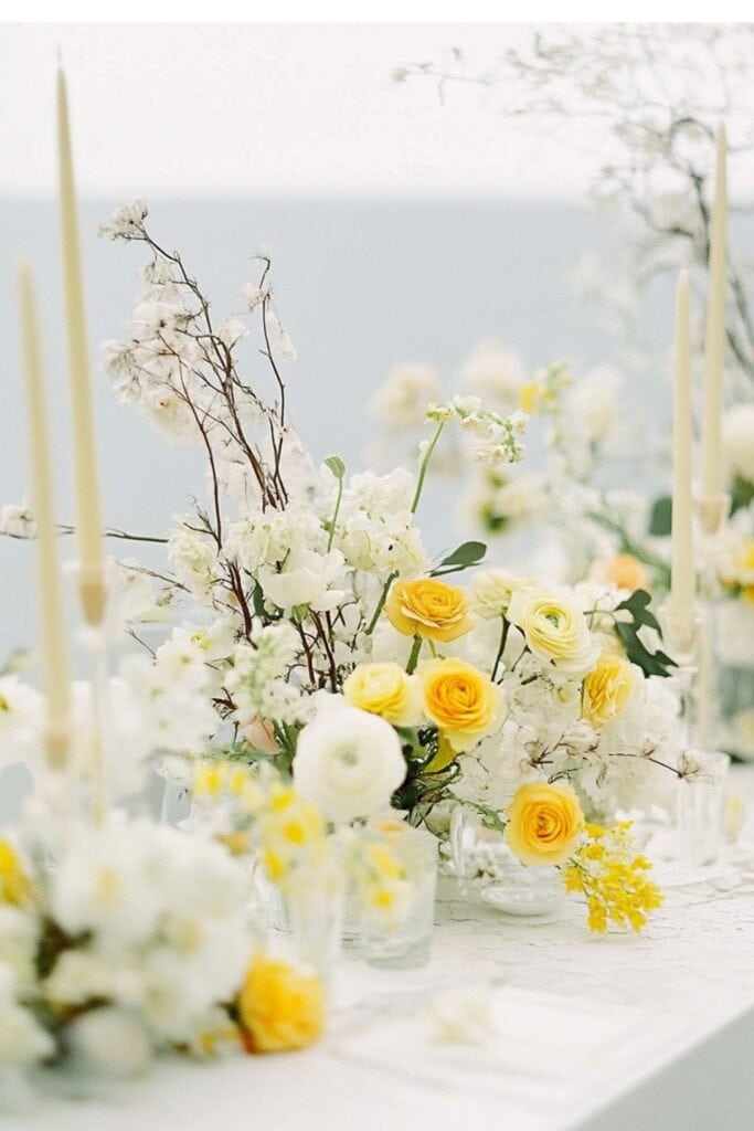 white and yellow floral centerpieces 